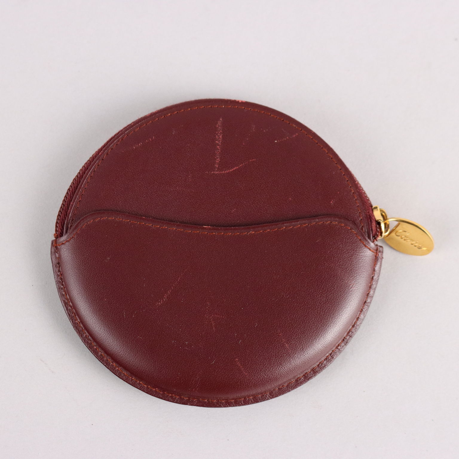 Lot - Cartier Coin Purse; Deep red leather Cartier coin purse with original  Cartier box.
